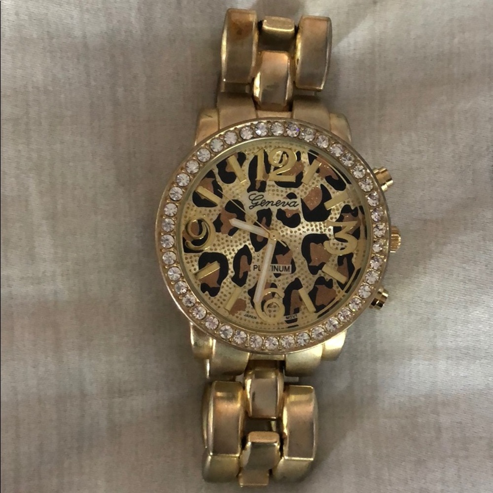 Gold color watch with cheetah print face